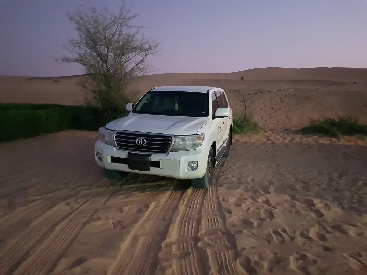 A Land Cruiser on a sandy track during a Dubai desert safari