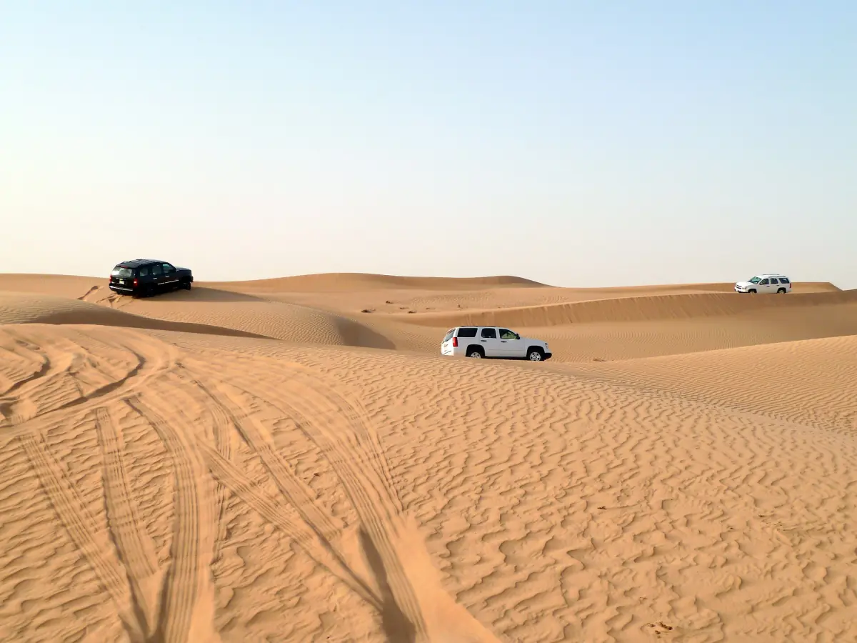 SUVs on rippled dunes during a desert safari in Dubai